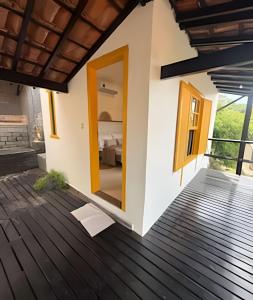 a house with a view of a bedroom at Villa Dolce Mare in Arraial do Cabo