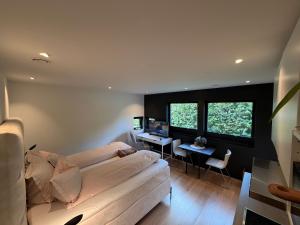 a living room with a couch and a desk at Guest rooms, ved Lillestrøm in Lillestrøm +40 photos