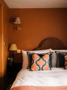 a bedroom with a bed with pillows on it at The Great Decoy in Hurstbourne Tarrant