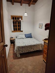 a bedroom with a bed and a dresser and a window at Glamp de Lujo Teques Granja El Sol in Xoxocotla +28 photos