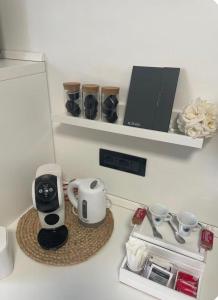 a kitchen counter with a coffee maker on a table at Vercelli Civico 31 in Vercelli