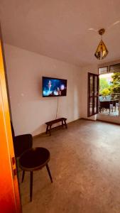 a living room with a flat screen tv on the wall at Dorey Home DEG1- Business-Apart l vollküche l WLan l Terasse bis 7 Personen in Deggendorf