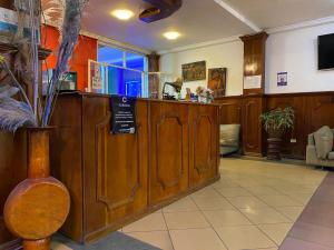 a salon with a counter in a room at Christian Palace in Tena