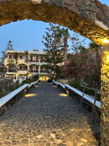 a view of a building from a stone archway at Santa Elena in Kamari