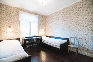 Ліжко або ліжка в номері Urshult Hotell