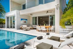 an exterior view of a villa with a swimming pool at Second Wind Villa in Long Bay Hills