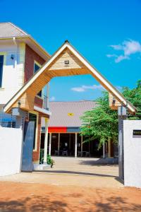 a building with an archway in front of it at JOSEPHINA LODGE Dodoma in Dodoma