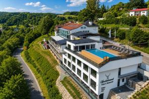 an aerial view of a house with a swimming pool at Hotel Spechtshaardt in Rothenbuch