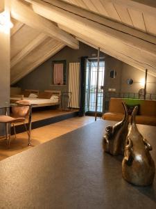 a room with a bedroom with a bed and a table at Lange in Priocca +57 photos