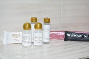 three bottles of moisturizers sitting on a counter at Amaras Boutique Hotel Lori in Stepʼanavan