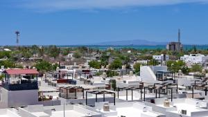 an aerial view of a city with white buildings at 3BR House with Pool & Rooftop Terrace in El Centenario
