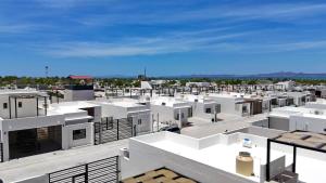 arial view of a city with white buildings at 3BR House with Pool & Rooftop Terrace in El Centenario