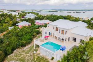 an aerial view of a house with a swimming pool at Breathtaking Chalk Sound Private Pool Sunset Villa in Providenciales +31 photos