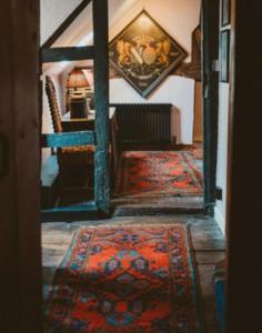 a view of a living room with a rug at St Columbas Boutique BnB in Weobley