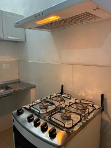 a stove top oven sitting in a kitchen at Apartamento, 88 in Cabo de Santo Agostinho