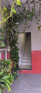 a stairway leading up to a building with a stair case at Apartamento, 88 in Cabo de Santo Agostinho