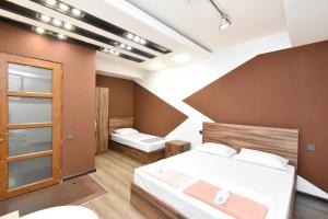 a bedroom with two beds in a room at Dur baca guest house in Yerevan