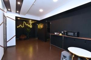 a room with a kitchen with a counter and a table at Dur baca guest house in Yerevan