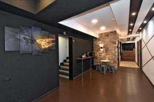 a hallway of a house with black walls and a staircase at Dur baca guest house in Yerevan