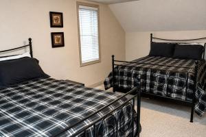 a bedroom with two beds and a window at JACKSON HOLE HIDEAWAY in Jackson