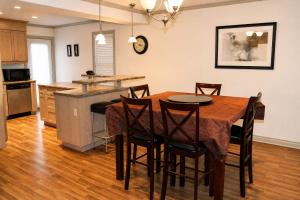 a kitchen and dining room with a table and chairs at JACKSON HOLE HIDEAWAY in Jackson