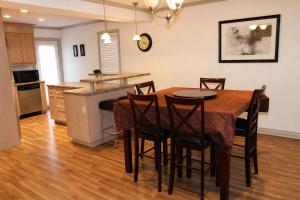 a kitchen and dining room with a table and chairs at JACKSON HOLE HIDEAWAY in Jackson +6 photos