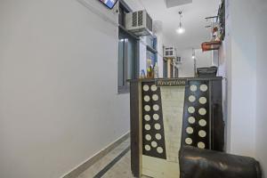 a ping pong table with a sign in a room at Hotel O The Premium Villa in New Delhi