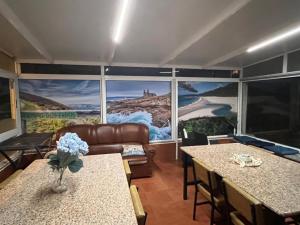 a living room with a couch and a table at Pensión Atlántico in Muxia