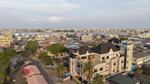 an aerial view of a city with a river and buildings at RAWADE Guesthouse in Cotonou