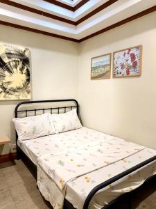 a bedroom with a bed in a room at Serenity Home - 4 bedroom home in Iloilo City