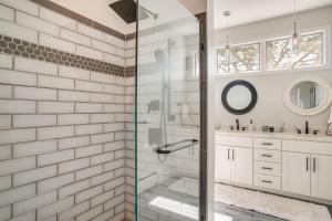 a bathroom with a shower with a glass door at Riverside Extended Stay in Mashpee in Mashpee +22 photos