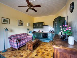 a living room with a couch and a table at Ferienwohnung Dreamy Daisy in Morbach