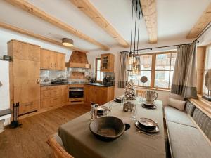 a kitchen with a table with a bowl on it at Wildrose in Wagrain