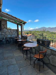 a group of tables and chairs on a patio at Pousada Mineira in Ouro Preto