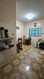 a kitchen with a table and chairs in a room at Pousada Mineira in Ouro Preto +31 photos