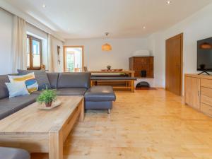 a living room with a couch and a coffee table at Tauernpanorama in Krimml