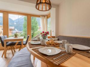a dining table with a plate of food on it at Tauernpanorama in Krimml