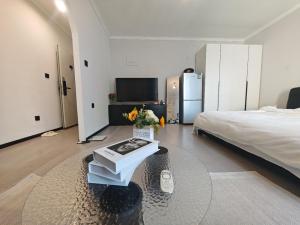 a bedroom with a bed and a table with books at Times International in Beijing