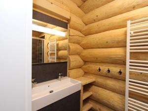 a bathroom with a white sink and wooden walls at Jenig 4B in Jenig +39 photos