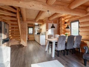 a kitchen and dining room with a table and chairs at Jenig 4B in Jenig
