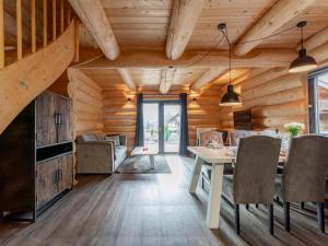 a dining room with wooden walls and a table and chairs at Jenig 5A in Jenig