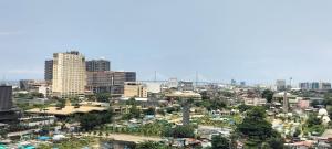 a city skyline with tall buildings in the background at Cozy33 The Persimmon Studio, Near Airport, SM, Ayala, Cebu Business Park, Cebu IT Park in Cebu City