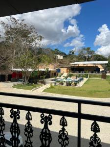 a view of a park from a balcony at Hotel Estação Chico in Garanhuns