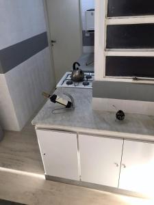a kitchen with a stove and a counter top at Palermo facing Las Heras Park in Buenos Aires +23 photos