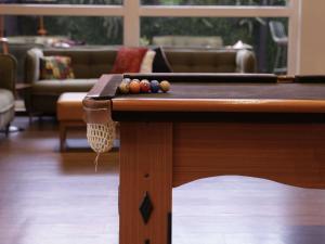 a pool table with balls on it in a living room at ibis Recife Boa Viagem in Recife