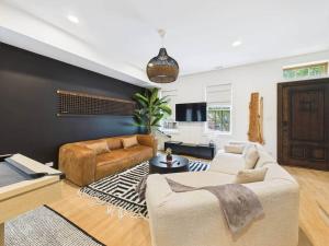 a living room with two couches and a couch at Luxe Chicago Retreat Game Room, Deck Fire Pit in Chicago +43 photos