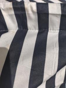 a close up of a black and white striped shirt at Cabaña con balcón luminosa in Ushuaia