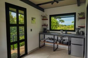 a bathroom with a sink and a window at Somni Hill in Torio