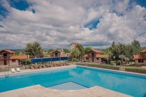 a swimming pool at a resort with at Cabañas Costa Alta in Mina Clavero