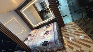 an overhead view of a couch in a room with a mirror at Gold House Premium in Quito